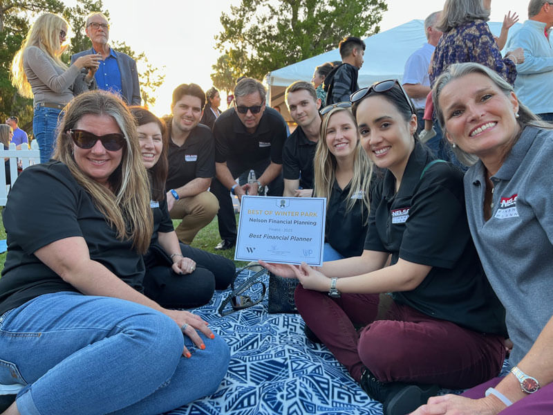 Nelson Financial Planning employees holding a finalist award for Best Financial Planner in Winter Park, FL