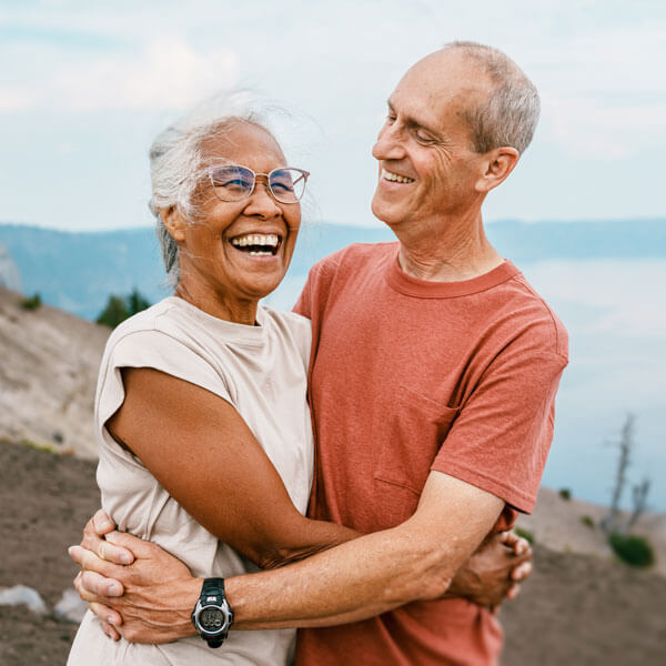 Joyful retired couple hiking